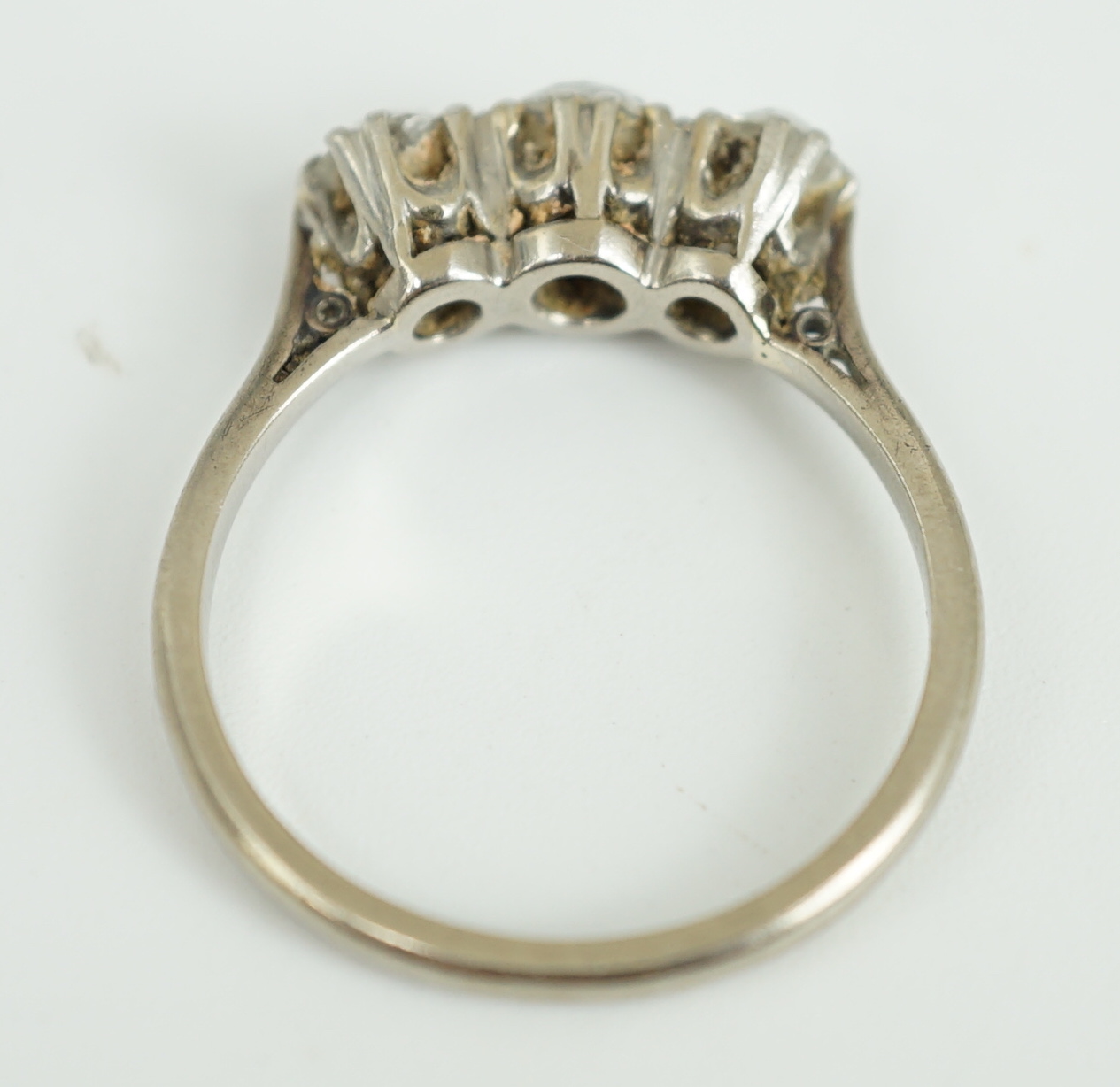 An 18ct white gold, platinum and three stone diamond set ring